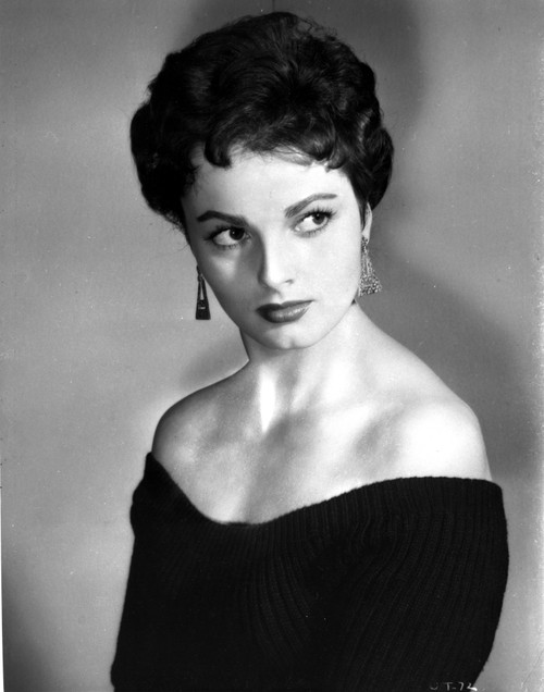 Ursula Theiss wearing a completely off the shoulder top, leering away from the camera Photo Print - Item # VARCEL706367