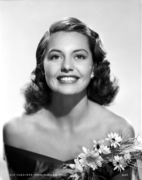 Cyd Charisse smiling in Black Dress with Flowers Photo Print - Item # VARCEL706449