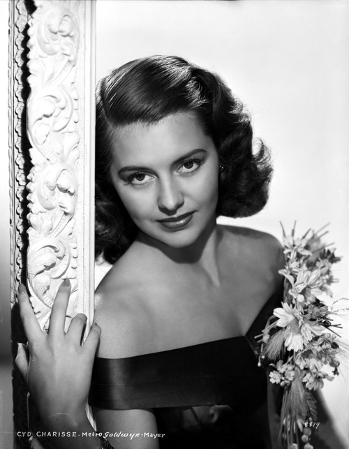 Cyd Charisse Posed in Black Blouse Holding Flower Photo Print - Item # VARCEL706455