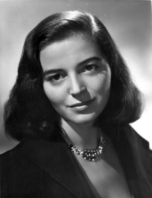 Marisa Pavan smiling in Black Suit with Necklace Photo Print