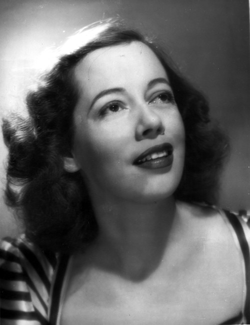 Imogene Coca Posed in a Printed Blouse and Looking Up Photo Print - Item # VARCEL706667