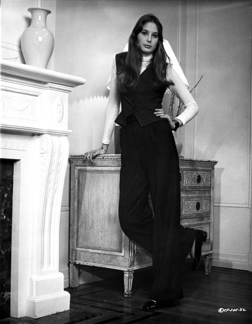 Deborah Raffin Leaning on a Drawer wearing Black Vest and Black Pants Photo Print - Item # VARCEL706872