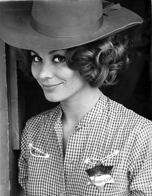 Irina Demick wearing a Checkered Polo with Hat Photo Print - Item # VARCEL706938