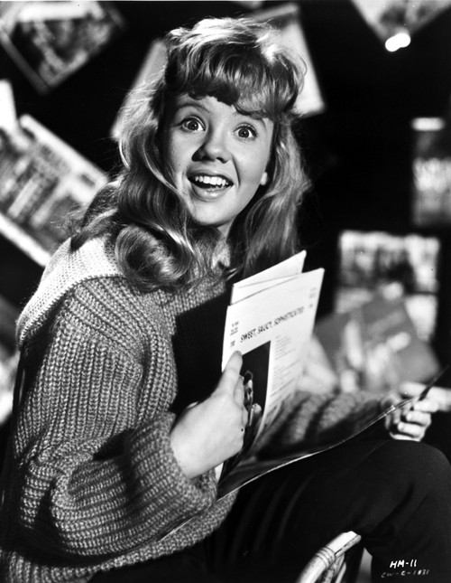 Hayley Mills wearing a Knitted Sweater Holding a Paper Photo Print - Item # VARCEL706997