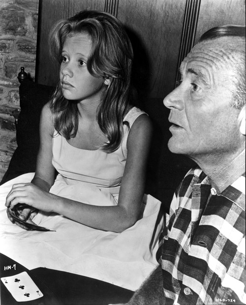 Hayley Mills playing cards with a man Photo Print - Item # VARCEL707023