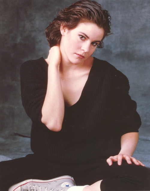 Ally Sheedy sitting on the Floor wearing Black Shirt and a Pair of Sneakers in Portrait Photo Print - Item # VARCEL707079