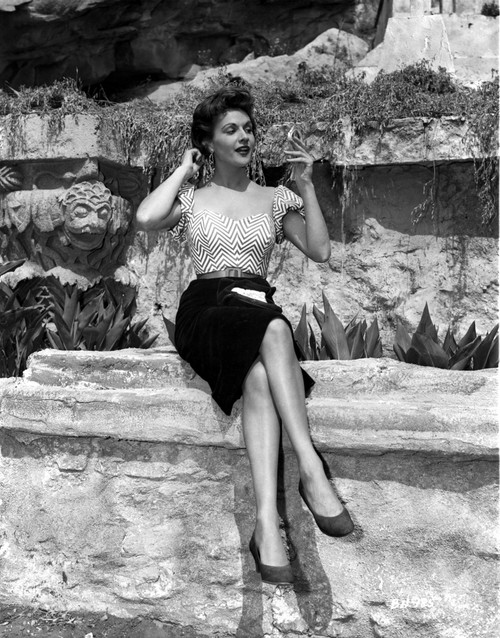 Nicole Maury Seated in Stripes Top and Black Skirt Photo Print - Item # VARCEL707240