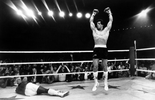 Sylvester Stallone Jumping in Topless Photo Print