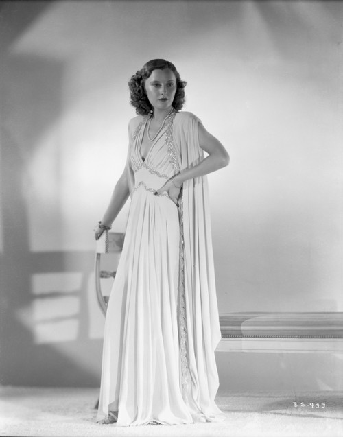 Barbara Stanwyck standing in White Long Dress Classic Portrait Photo Print - Item # VARCEL707528