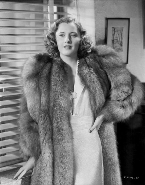 Barbara Stanwyck Leaning in Furry Coat in Black and White Portrait Photo Print - Item # VARCEL707555