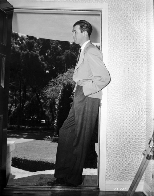 James Stewart Posed in Long Sleeve Collar Shirt and Black Linen Pants while Leaning Back on the Wall Photo Print - Item # VARCEL707940