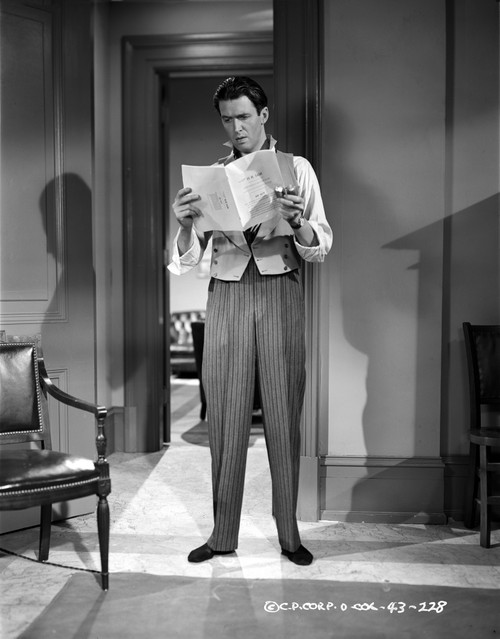 James Stewart standing in White Long Sleeve Shirt and Vest Suit while Reading a Paper Photo Print - Item # VARCEL707960