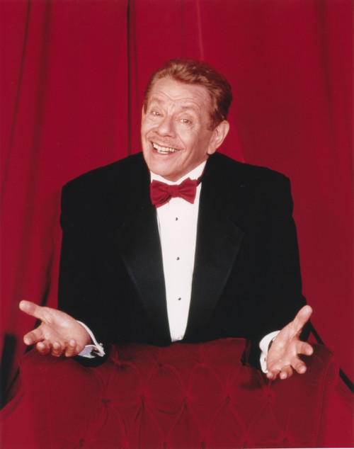 Jerry Stiller Posed in Black Suit and Red Bow Tie in Red Background Photo Print - Item # VARCEL707975