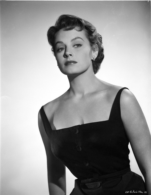 Victoria Shaw posed looking away from the camera with an eyebrow raised, while wearing a black, sleeveless dress Photo Print - Item # VARCEL707985