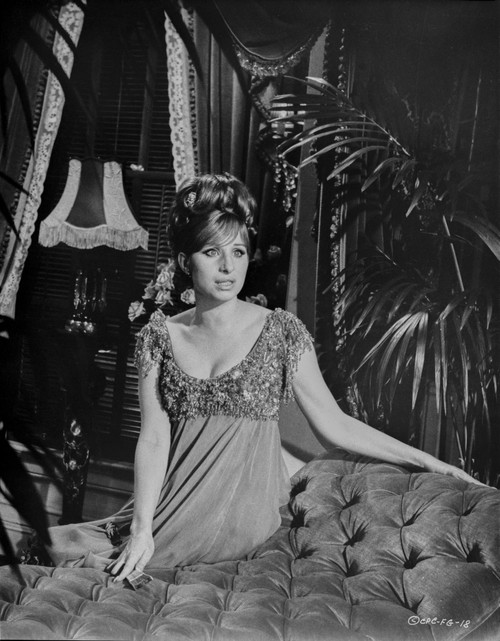 Barbra Streisand Leaning On A Couch In Sexy Dress Photo Print - Item # VARCEL708021