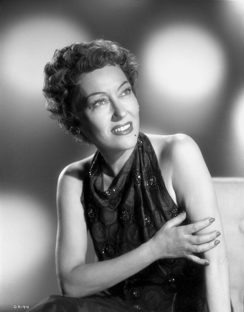 Gloria Swanson Red lipstick, Curly Hairdo wearing Black Gown Photo Print - Item # VARCEL708165