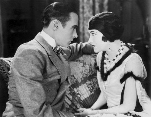 Gloria Swanson Staring with a Guy wearing Formal Outfit Photo Print - Item # VARCEL708218