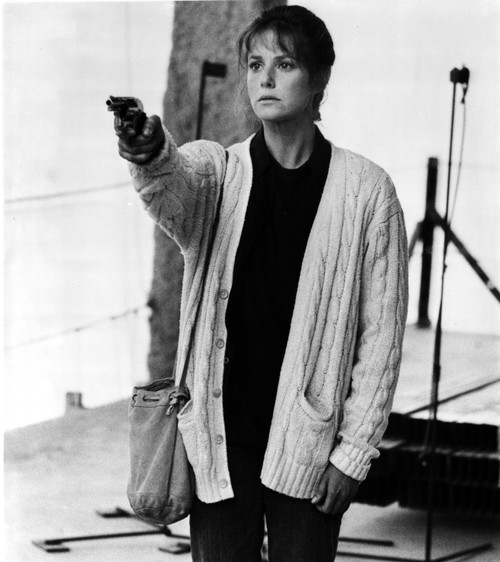 Debra Winger Holding Pistol in Classic Photo Print - Item # VARCEL708349