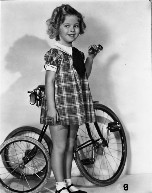 Shirley Temple holding her Tricylce bike Photo Print - Item # VARCEL708434
