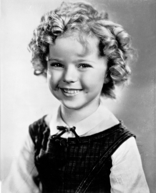 Shirley Temple wearing a White Blouse with a Black Gymslip Photo Print - Item # VARCEL708481