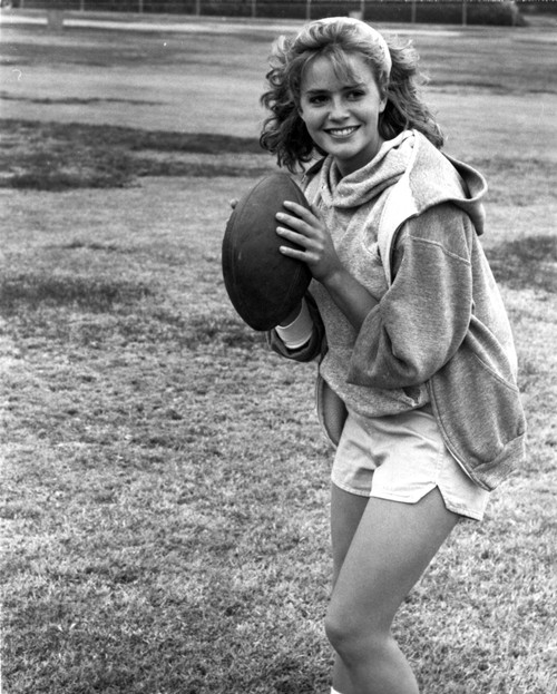 Elizabeth Shue Holding Football in Classic Photo Print - Item # VARCEL708698