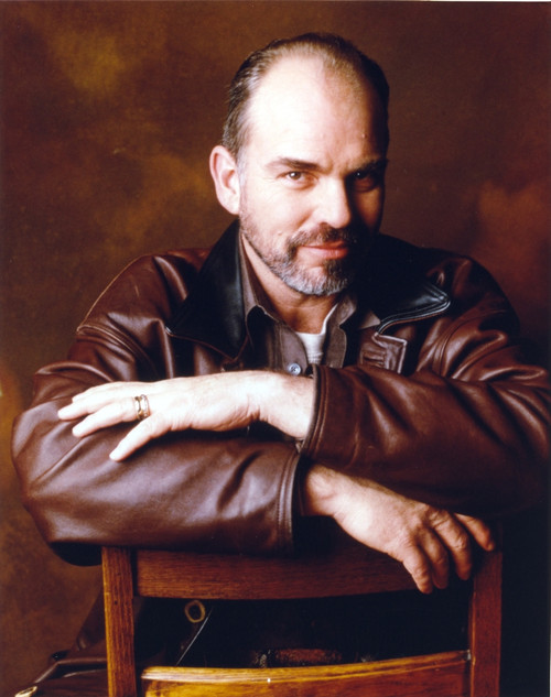 Billy Thorton Leaning on Chair in Brown Leather Jacket Portrait Photo Print - Item # VARCEL708841