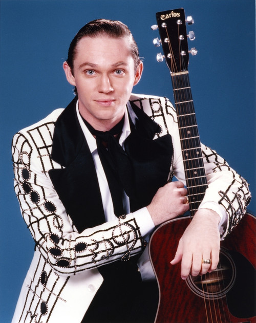 Richard Thomas Holding a Guitar in White Coat Photo Print - Item # VARCEL708821