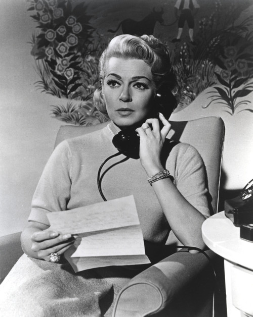 Lana Turner Holding a Paper with Telephone Black and White Photo Print - Item # VARCEL708987