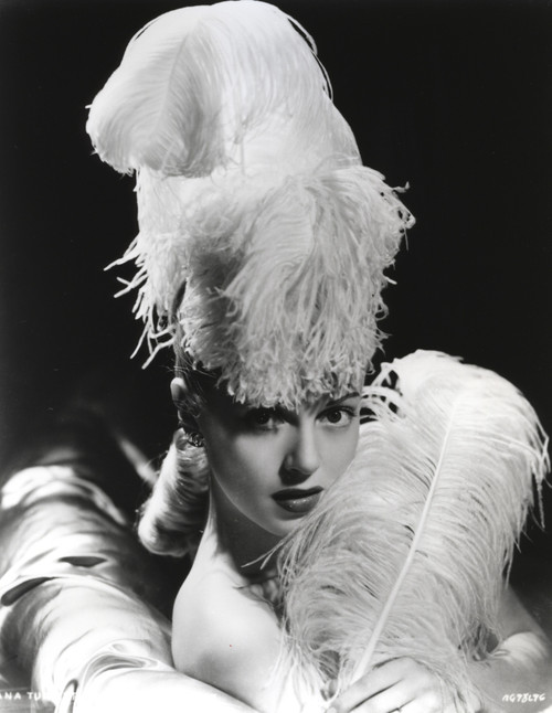 Lana Turner posed in Feathery Dress with Black Background Photo Print - Item # VARCEL709043