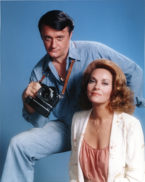 Robert Vaughn Holding a Camera in Blue Background Photo Print - Item # VARCEL709135