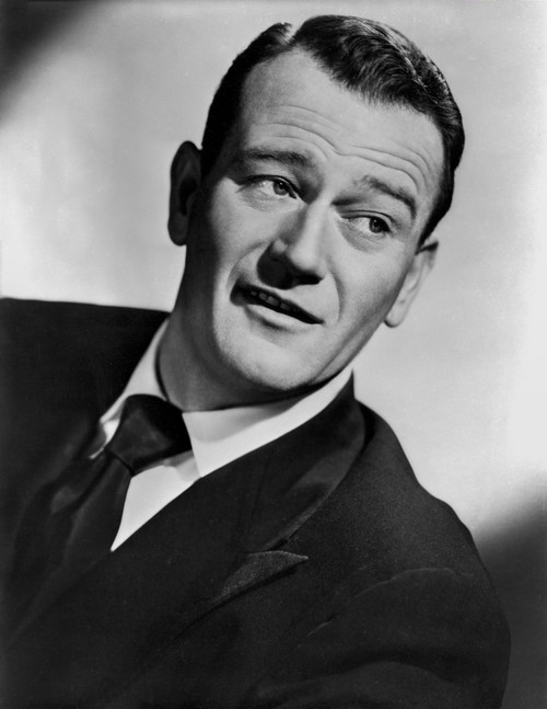 John Wayne Looking to the Left, wearing a Black Suit and Tie Photo Print - Item # VARCEL709225