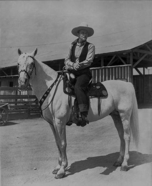 John Wayne on white horse Photo Print - Item # VARCEL709208