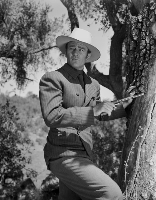 John Wayne with gun and hat Photo Print - Item # VARCEL709213