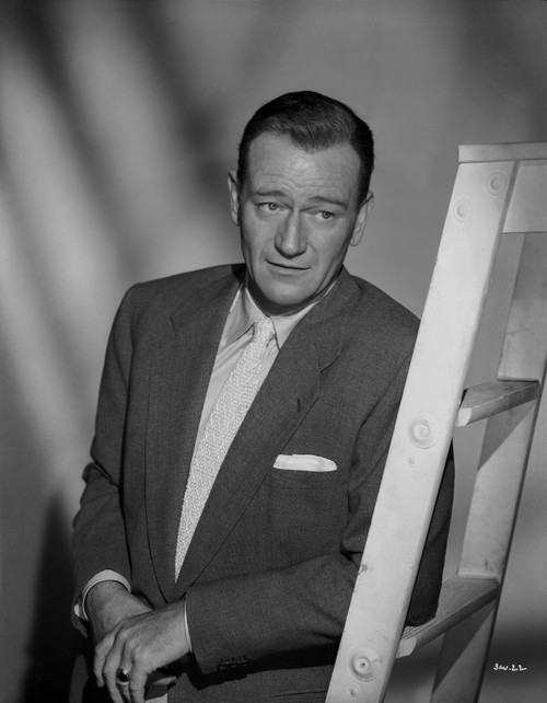 John Wayne Leaning on a Portable Ladder Photo Print - Item # VARCEL709224