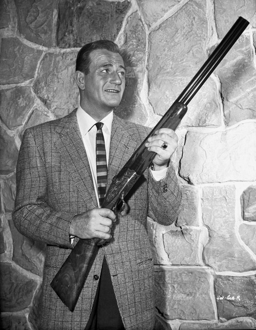 John Wayne with rifle Photo Print - Item # VARCEL709226