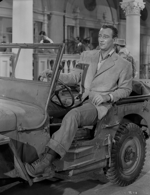 John Wayne in automobile Photo Print - Item # VARCEL709237