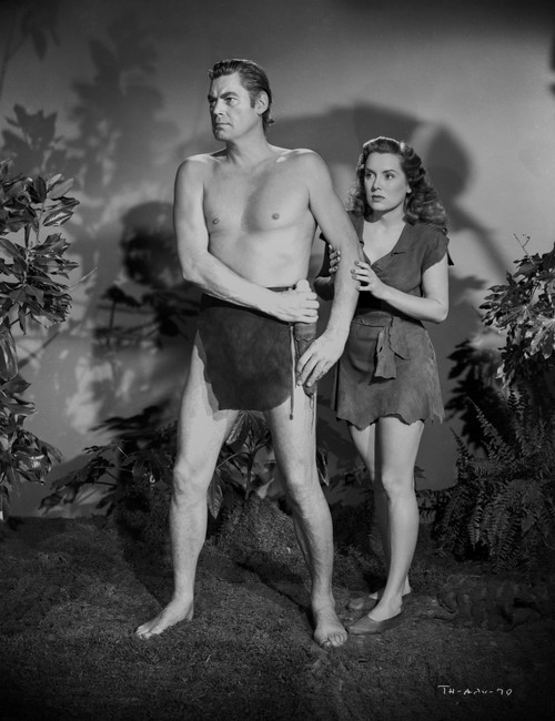 Johnny Weissmuller Defending a Woman in a Movie Scene Photo Print - Item # VARCEL709301