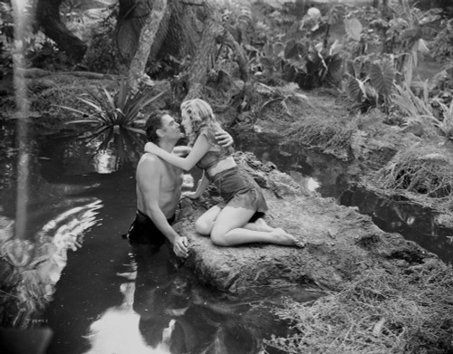 Johnny Weissmuller Kissing with a Woman in the River in a Classic Movie Scene Photo Print - Item # VARCEL709330