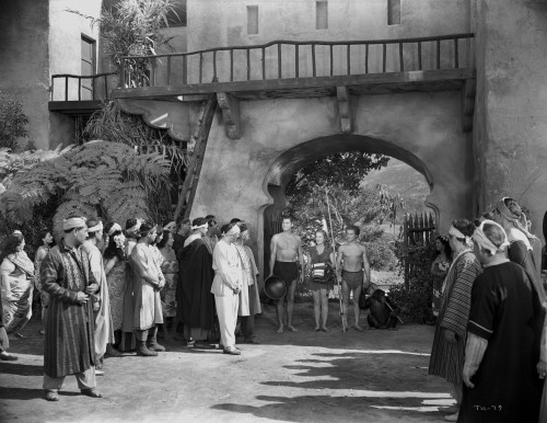 Johnny Weissmuller Walking with His Family in the Town in a Movie Scene Photo Print - Item # VARCEL709347