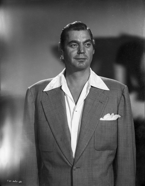 Johnny Weissmuller wearing a Suit with a Handkerchief as Decoration in a Portrait Photo Print - Item # VARCEL709354
