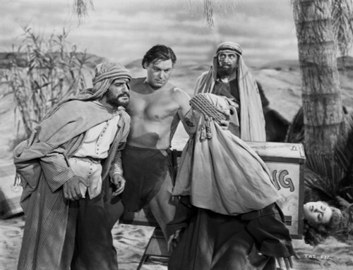 Johnny Weissmuller Talking to a Guy wearing Turbans in a Movie Scene Photo Print - Item # VARCEL709357