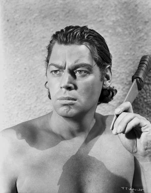 Johnny Weissmuller Holding a Knife in Black and White Photo Print - Item # VARCEL709334