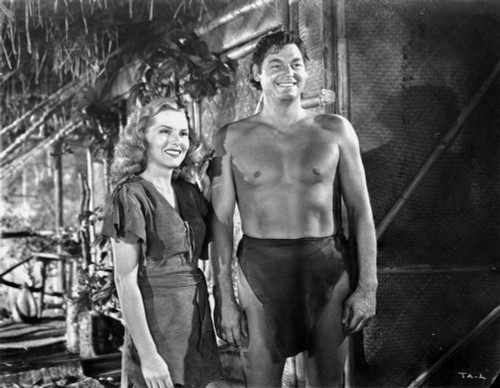 Johnny Weissmuller laughing with a Woman in a Classic Movie Scene Photo Print - Item # VARCEL709386