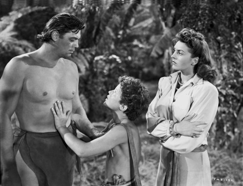 Johnny Weissmuller Talking to a Worried Kid in a Movie Scene Photo Print - Item # VARCEL709372