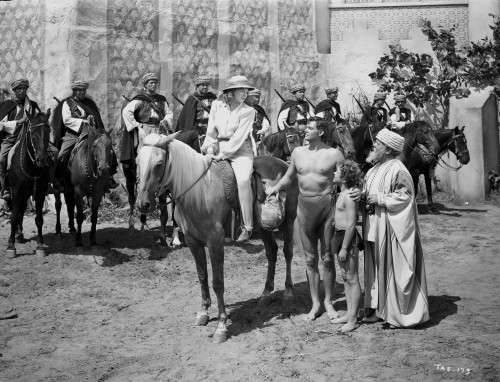 Johnny Weissmuller Saying Goodbye to a Woman Riding a Horse in a Classic Movie Scene Photo Print - Item # VARCEL709415