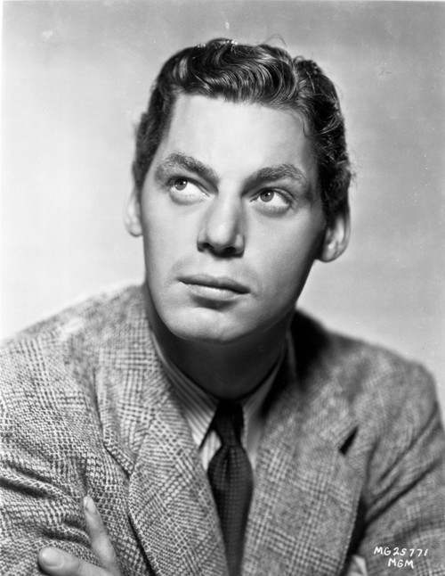 Johnny Weissmuller wearing a Suit and a Black Necktie while Looking Up Photo Print - Item # VARCEL709442