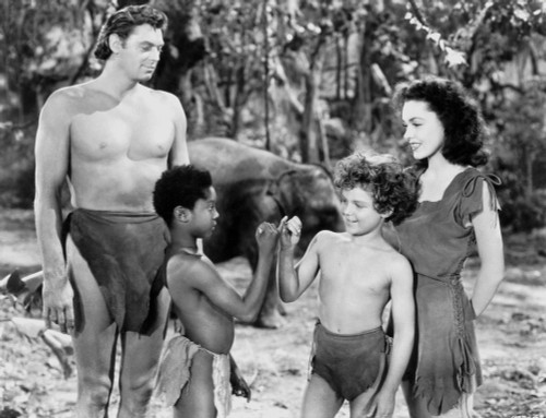 Johnny Weissmuller standing with Two Kids and a Woman in a Movie Scene Photo Print - Item # VARCEL709448