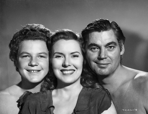 Johnny Weissmuller Taking a Close Up Group Picture in a Classic Movie Scene Photo Print - Item # VARCEL709424