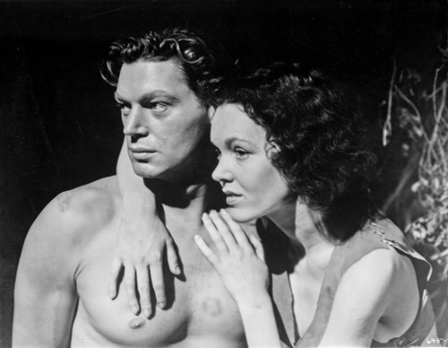 Johnny Weissmuller Hugged by a Woman in a Movie Scene Photo Print - Item # VARCEL709462