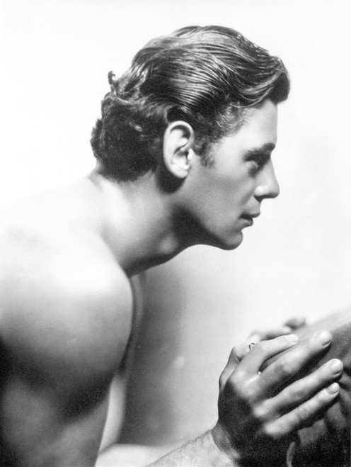 Johnny Weissmuller Holding a Cloth in a Classic Movie Scene Photo Print - Item # VARCEL709433